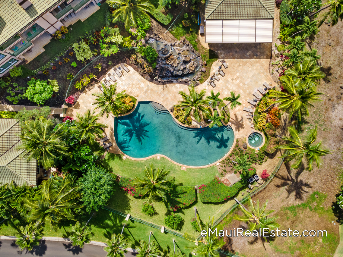 The pool is surrounded in privacy and tranquility with tropical landscaping