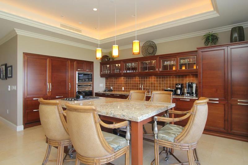 Cherry finish cabinets in a Plumeria floor plan