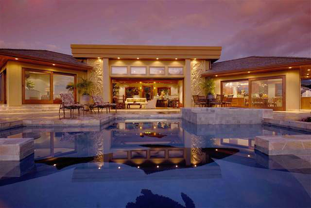 A patio with table overlooking the ocean