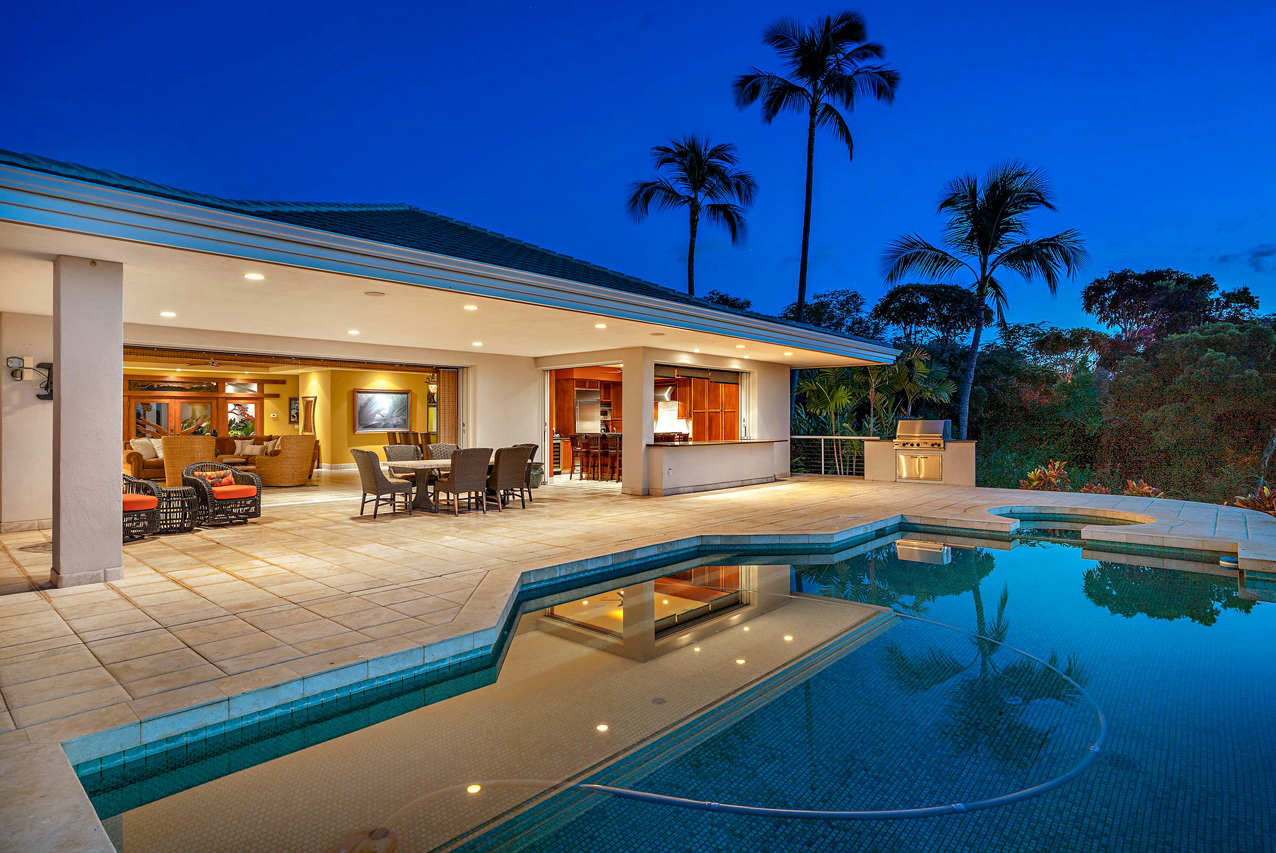 A patio with table overlooking the ocean