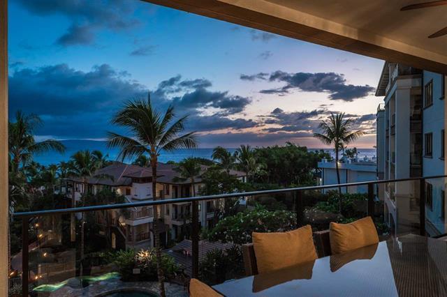 A patio with table overlooking the ocean